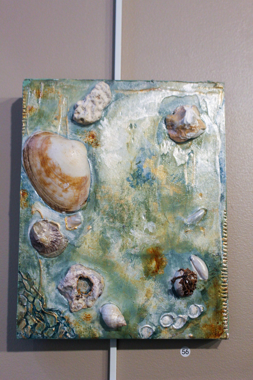 Natalie Boburka's seashell mixed media piece on view inside the Gugg Gallery.