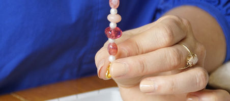 Stacey beading a necklace