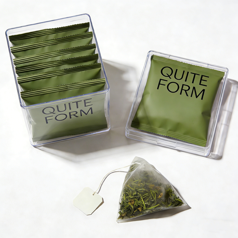 QUITE FORM green tea pouches in clear containers with pyramid teabag.