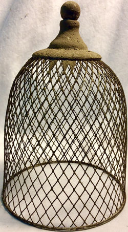 Portable bird cage, metal and concrete like material.