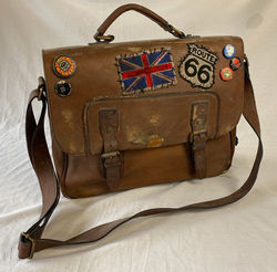 Aged brown leather shoulder bag with patches and buttons