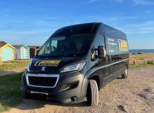 Black Peugeot van with full tkb sign writing and logo in yellow