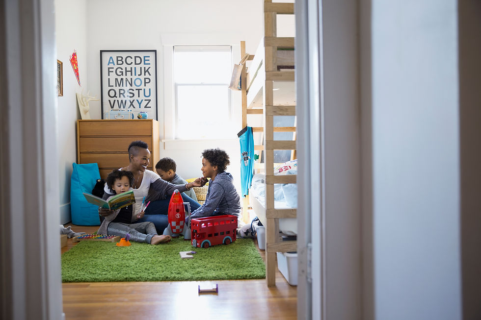 Family Reading in Bedroom
