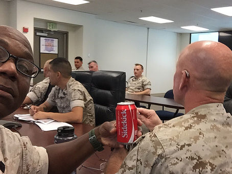 King Size and his sidekick Bite Size in a Staff Meeting