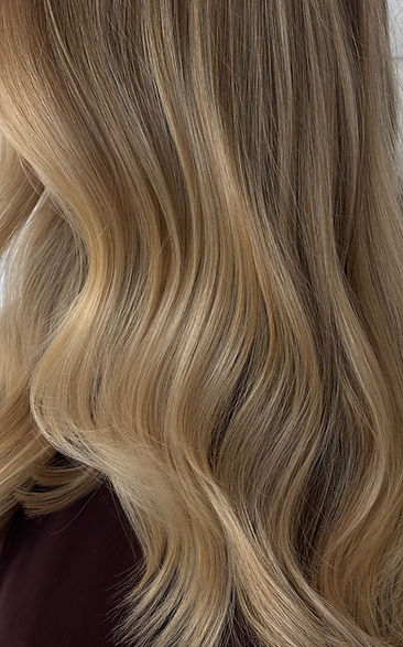 a close up of blonde styled hair