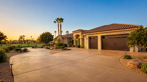Earth-toned concrete driveway at a single-story home in Sun Lakes AZ, 55+ community concrete contractor