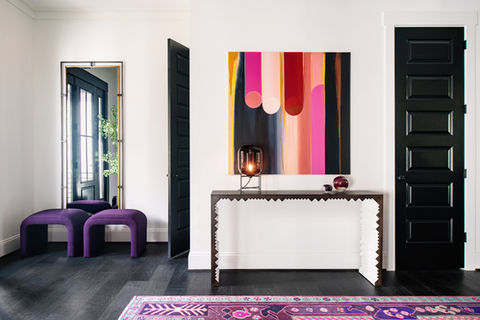 Bold artwork and furniture in entryway