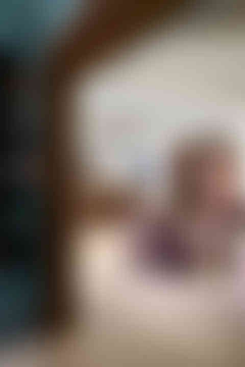 Basement renovation with four club chairs and cozy reading nook