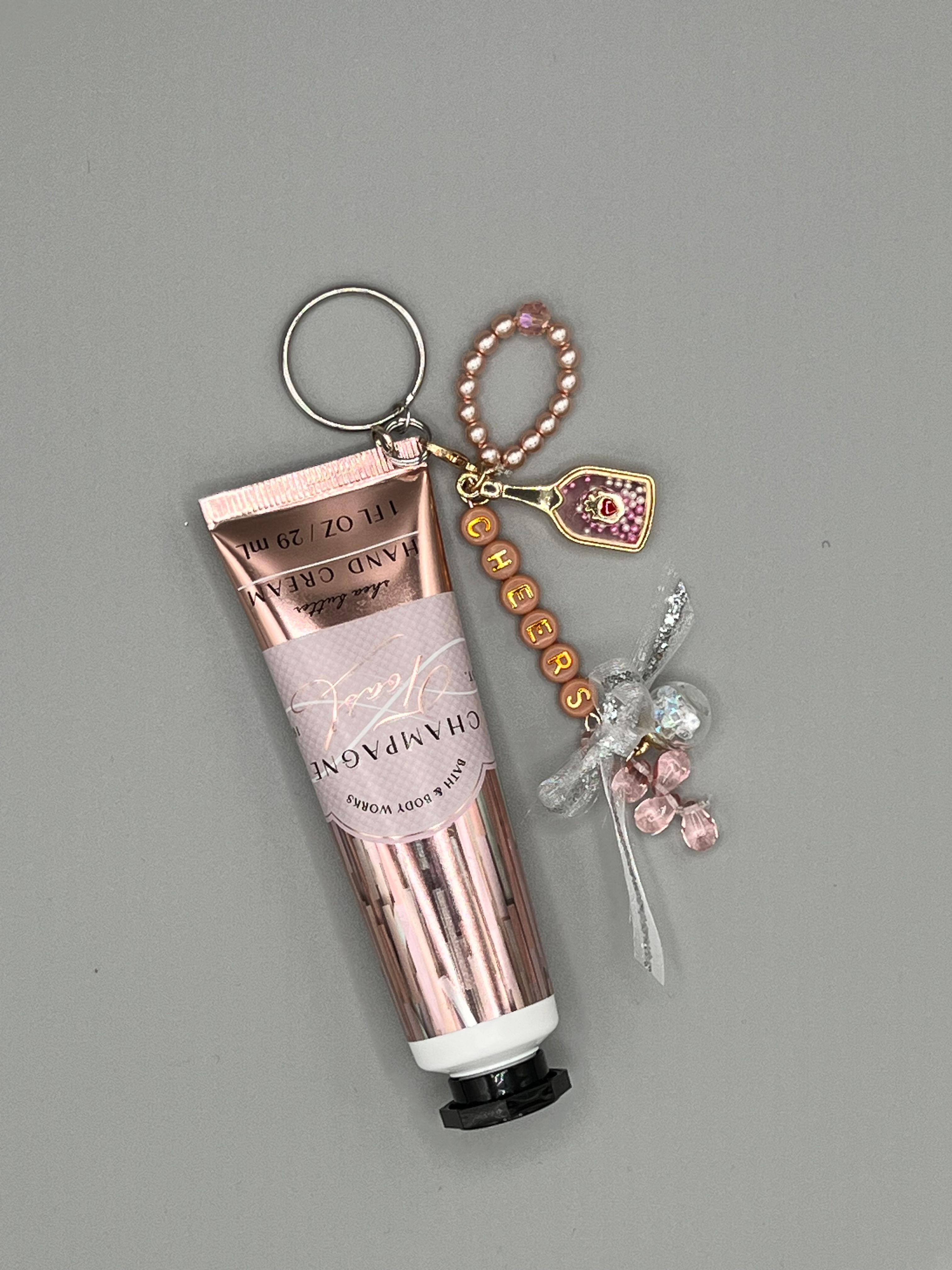 DINGLE DANGLE: HAND CREAM Keychain charm - CHAMPAGNE TOAST