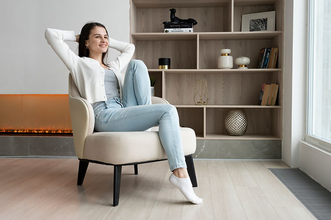 full-shot-smiley-woman-sitting-chair.jpg