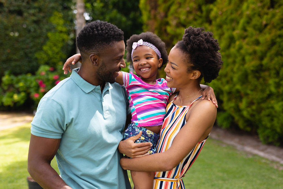 happy-african-american-parents-carrying-cute-daughter-while-standing-garden.jpg