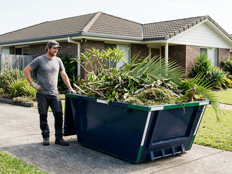 Skip bin filled with garden waste in a suburban driveway after a yard cleanup.