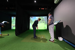 Commercial dual-bay golf simulator setup at Mt Martha Golf Club with GSPro software, Uneekor tracking, and modern bar-style seating — installed by Golfsim Australia.
