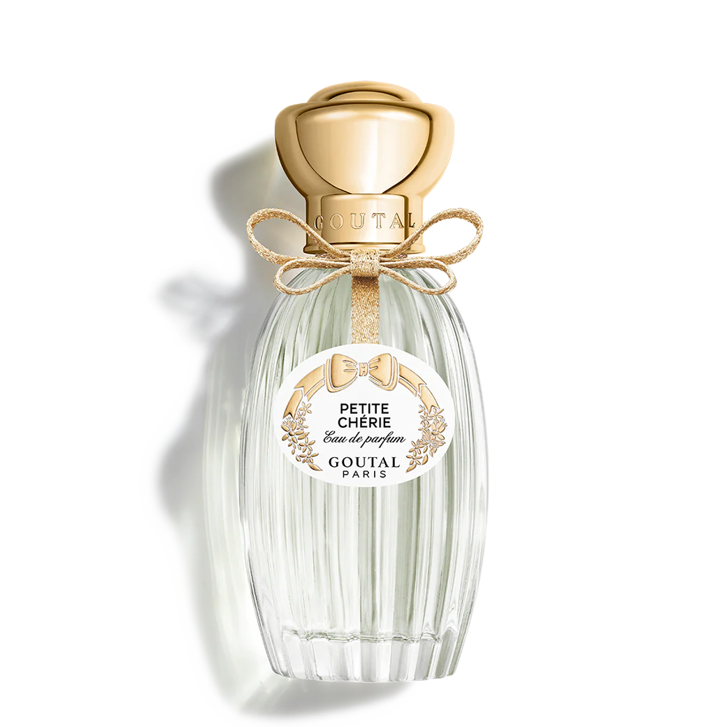 clear perfume bottle with gold cap and ribbon
