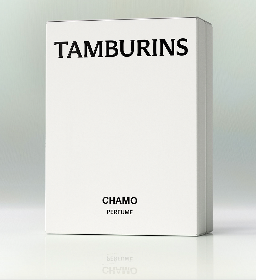White box labeled "TAMBURINS CHAMO PERFUME" with subtle reflection. Minimalist design on a light gradient background.