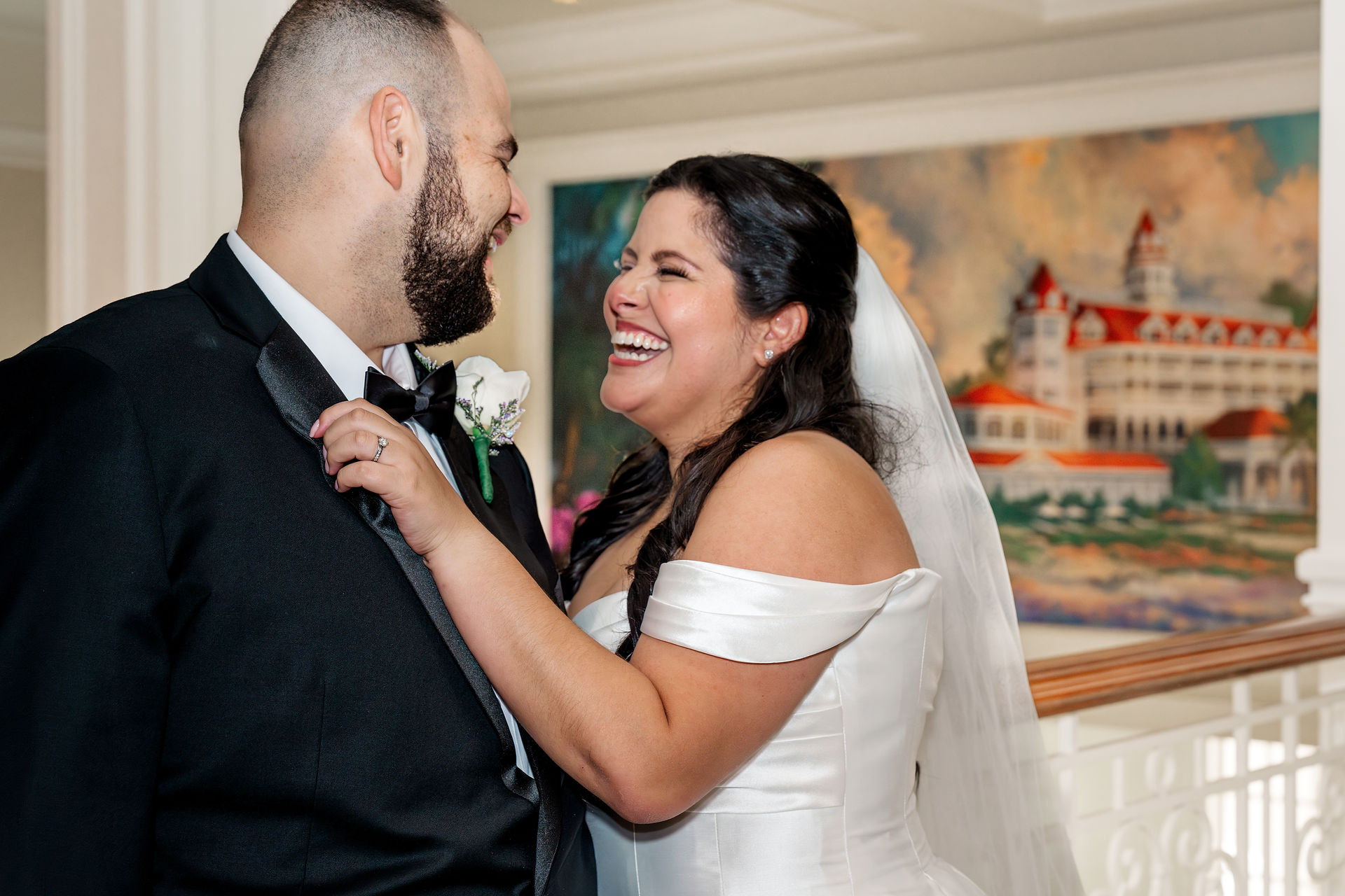 Bride and groom photos on Disney’s newly renovated Grand Floridian staircase. By Honeycomb Films.