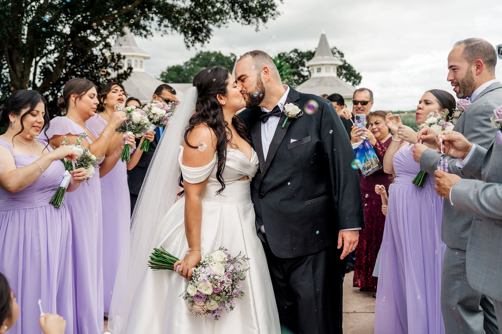 Wedding Bubble Exit at Disney's Wedding Pavilion with Cinderella Castle. By Honeycomb Films.