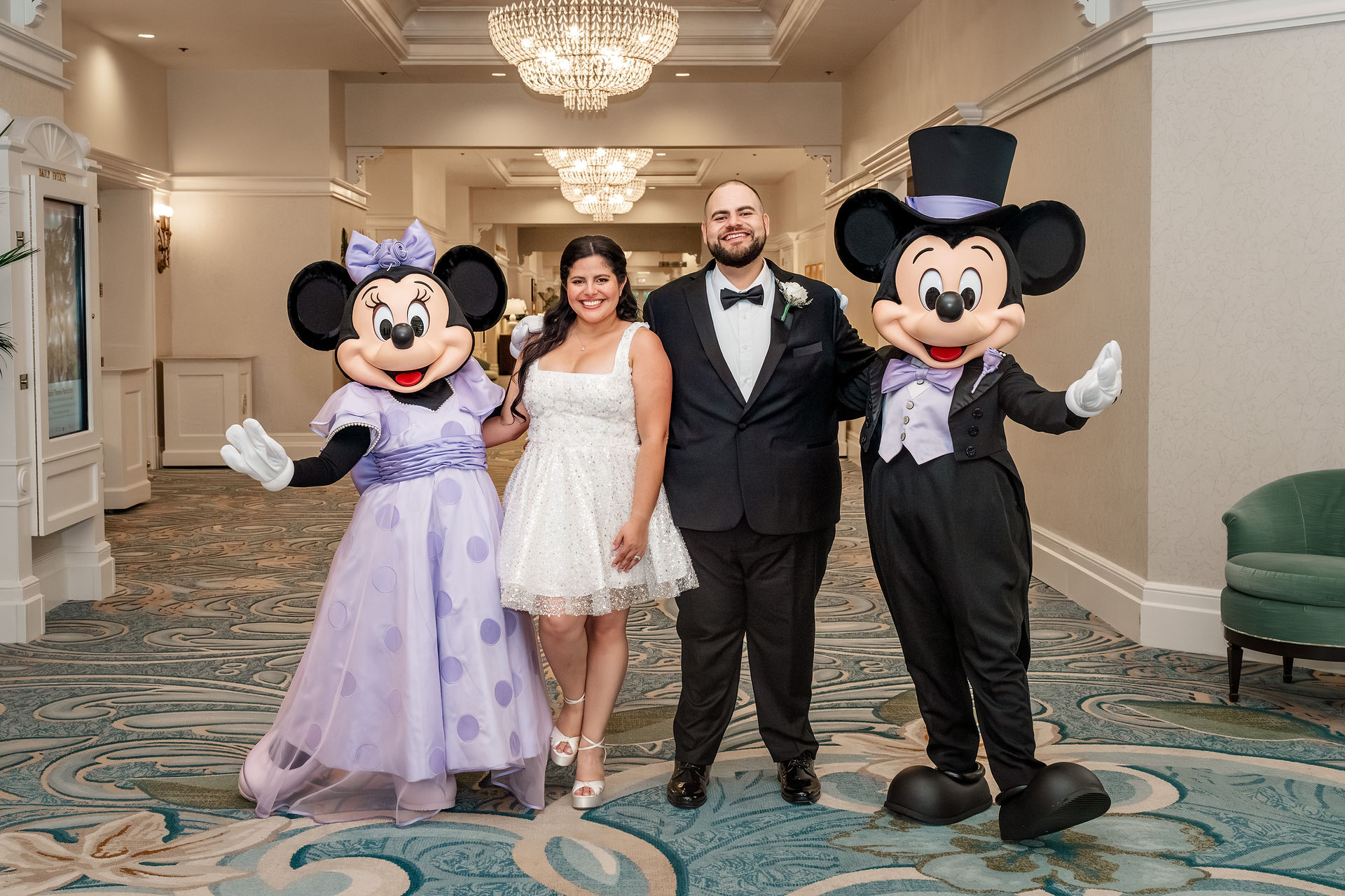 Mickey and Minnie wedding guests in Lavender Attire. Photo by Honeycomb Films.