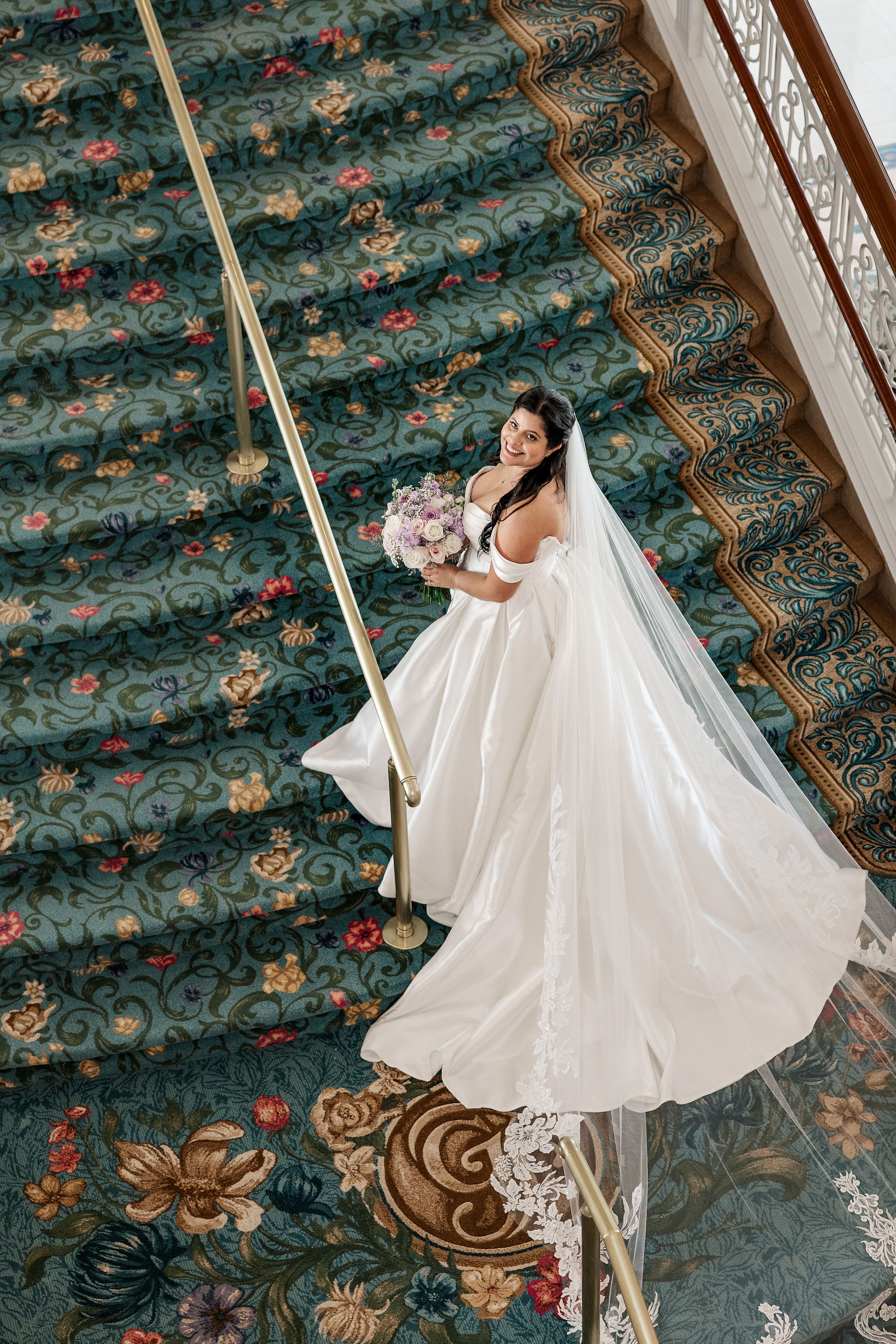 Bridal portrait photos on Disney’s newly renovated Grand Floridian staircase. By Honeycomb Films.
