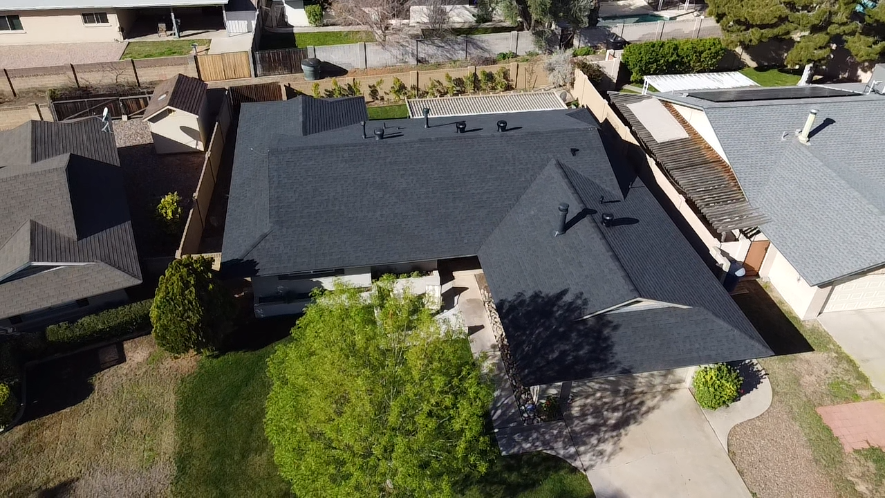 Charcoal Grey lifetime shingle roof system installed by Americas Best Roofing Company in Tucson, AZ.