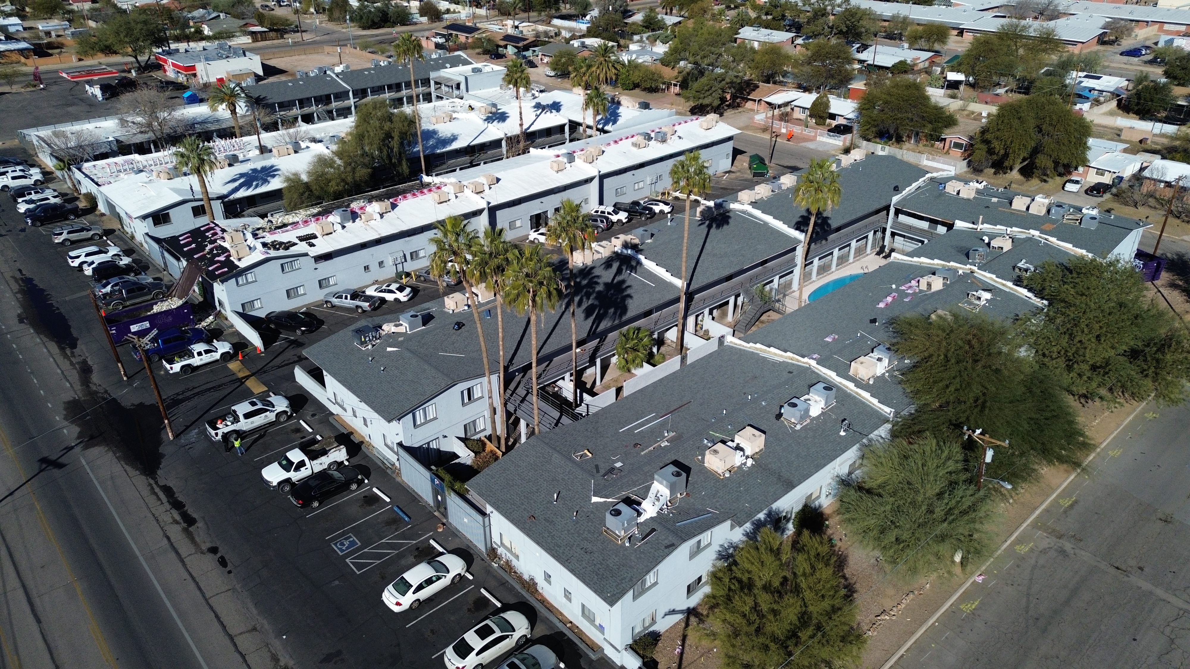America's Best Roofing Company installing a lifetime Owens Corning shingle roof system on Andmark Pima apartments in Tucson.