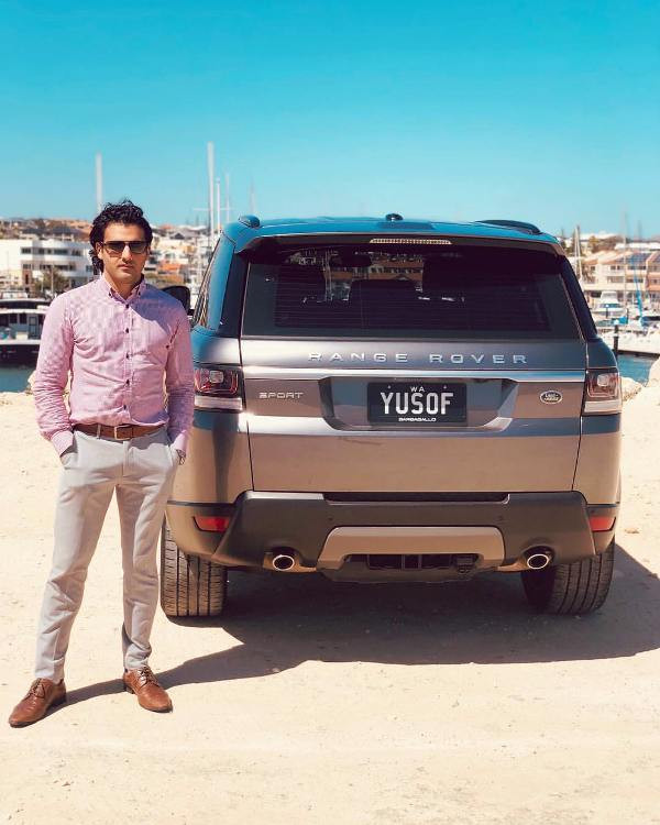 Yusof Mutahar Posing with His Range Rover