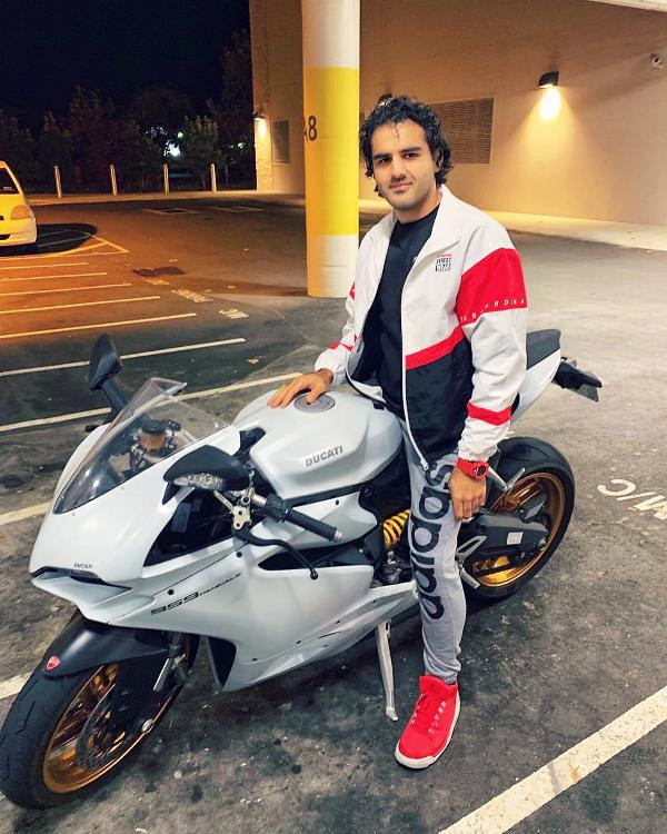 Yusof Mutahar Posing with His Motorcycle