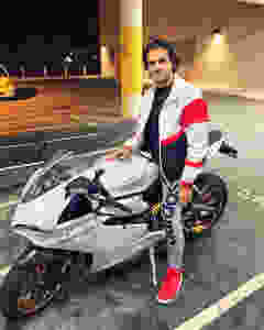 Yusof Mutahar Posing with His Motorcycle