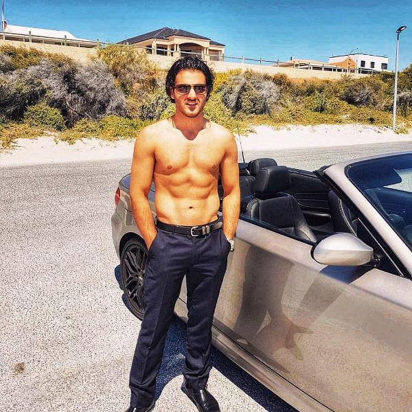 Yusof Mutahar Posing with His Car