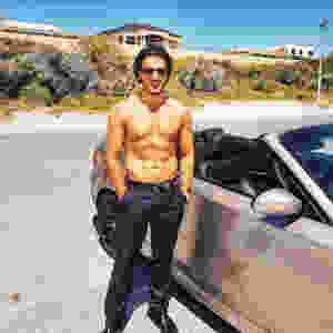 Yusof Mutahar Posing with His Car