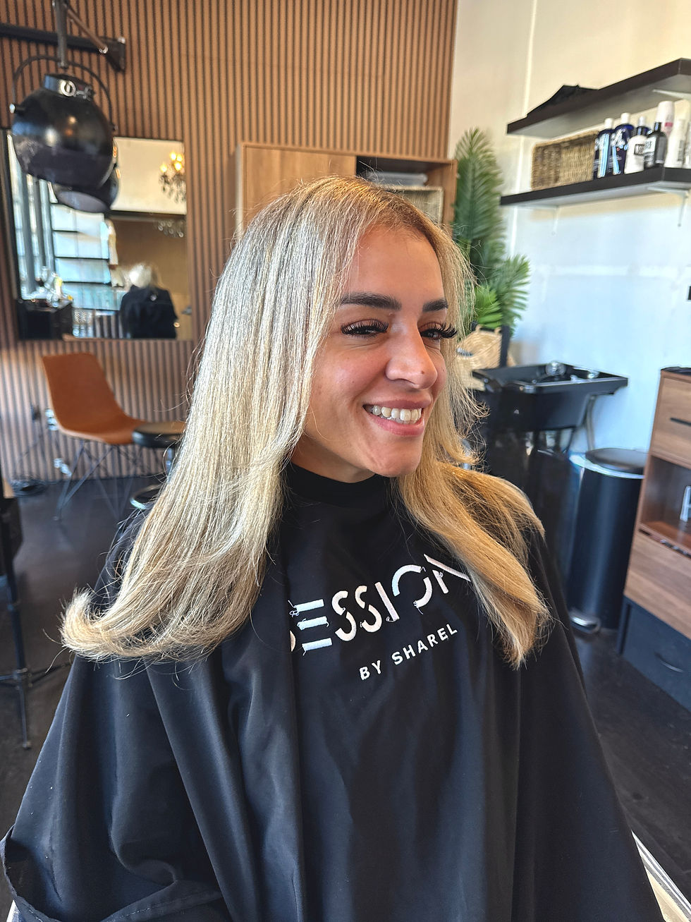 Blonde hair color with bright face-framing highlights.