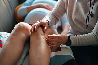 Pregnant woman getting acupuncture treatment.jpg