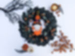 Halloween black wreath with Halloween gnome in center
