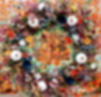 Colorful foliage wreath with various flowers, berries, greenery, and white pumpkins.