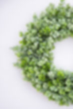 Thumbnail: Detail of white flocked artificial eucalyptus wreath.