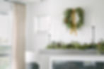 Holiday wreath above a mantle
