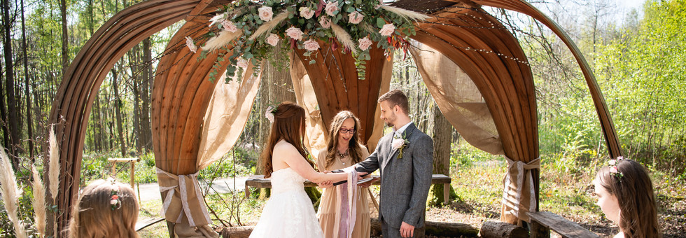 Local celebrant Alex Hilder performs a woodland handfasting ceremony at the Bower in the Wood. One of two licensed areas for civil ceremonies.
