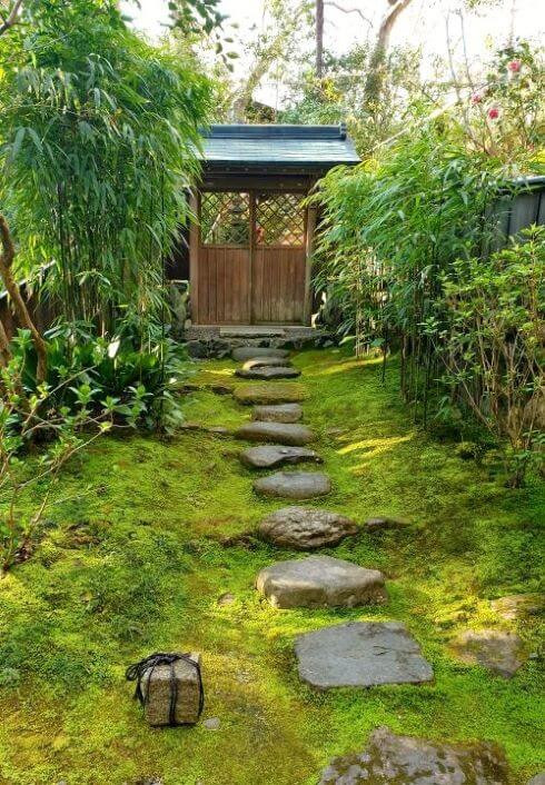A rock pathway surrounded by moss, in the garden at Honen-in temple.