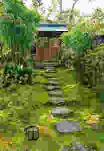 A rock pathway surrounded by moss, in the garden at Honen-in temple.