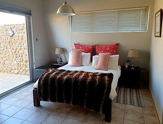 Bedroom accommodation at Naankuse Lodge in Namibia