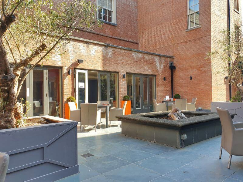 Outdoor seating at Reflections restaurant at Alexander House Hotel in West Sussex