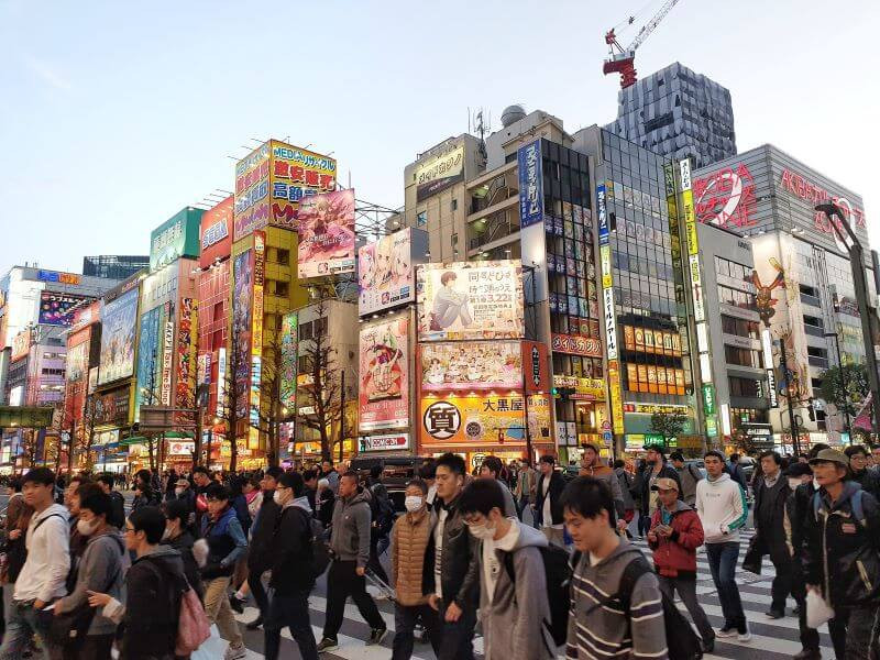 Shibuya crossing filled with pedestrians, in Tokyo