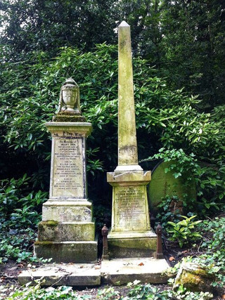Obelisks and urns on gravestones during a Highgate West Cemetery tour