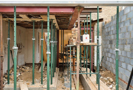 Steel props supporting the structure above during a wall removal