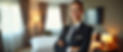 a_friendly_and_professional_hospitality_staff_member_standing_confidently_in_a_neatly_arra