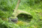 a-lawn-mower-is-cutting-green-grass-237V
