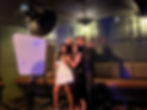 Four guests posing at a photo booth for parties