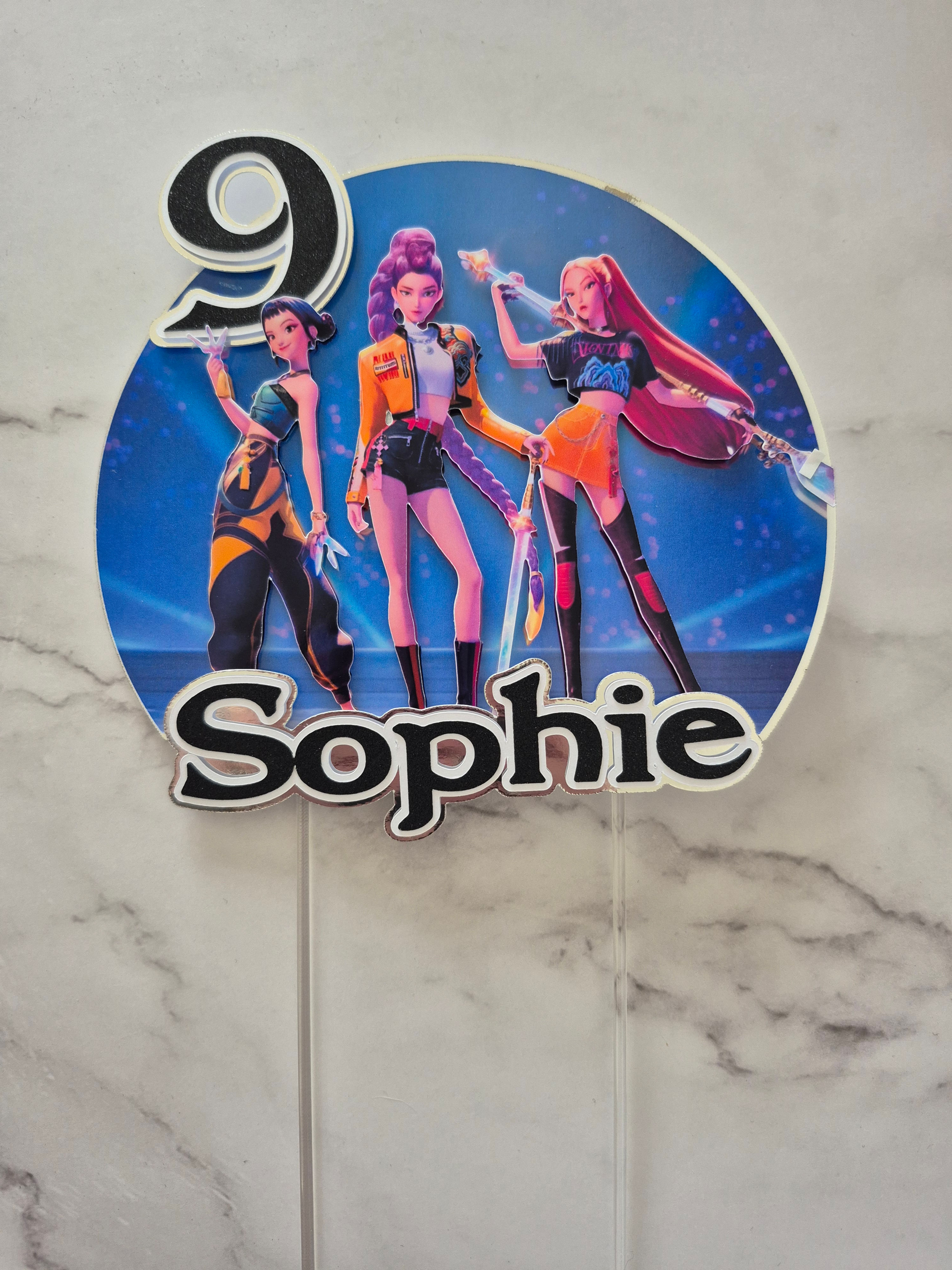 Personalised Demon Hunters birthday cake topper with custom name and age, printed on gloss photo paper with removable acrylic