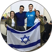Mechina Olamit participants proudly holding the Israeli flag in IDF uniforms