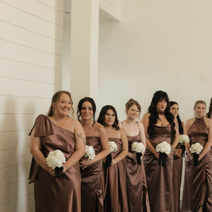 Bridesmaids during ceremony at barn wedding venue